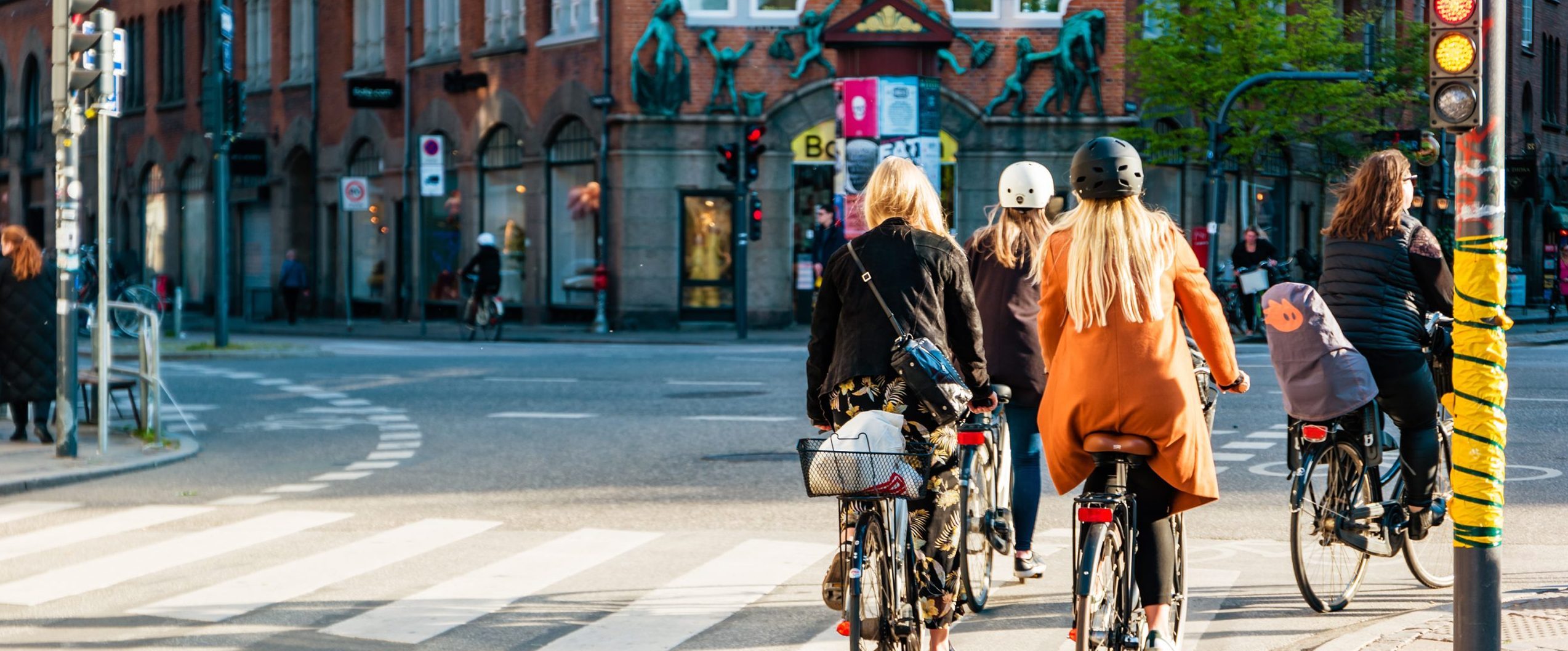 Street life in Copenhagen. People riding bikes in the city center.